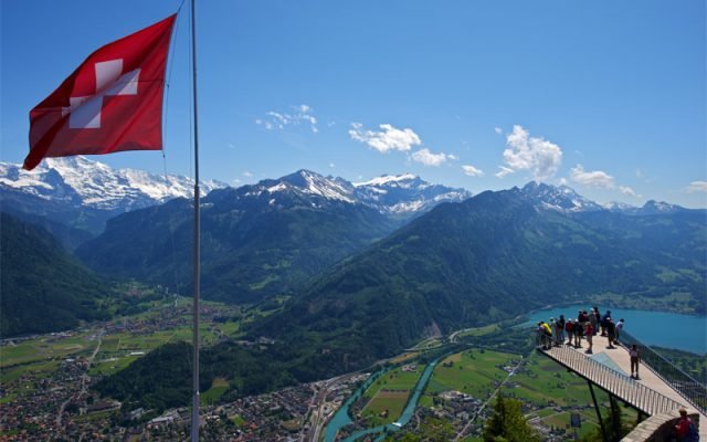 Switzerland. get natural. You can take the cable car from Interlaken to the home mountain of Harder Kulm in eight minutes. The restaurant looks like a small castle, and it is located 1â€¿322 metres above sea level. The Harder Kulm is the starting point for mountain hikes. It also offers a beautiful view of the Eiger, Moench and Jungfrau mountains as well as Lake Thun and Lake Brienz.

Schweiz. ganz natuerlich. In acht Minuten faehrt man mit der Drahtseilbahn von Interlaken auf denÂ Hausberg Harder Kulm. Auf 1â€¿322 Meter ueberÂ Meer liegt das Restaurant, das einem kleinen Schloss gleicht. Der Harder Kulm ist Ausgangspunkt fÃ¿r Bergwanderungen. Und er bietet eine wunderschoene Sicht auf Eiger, Moench und Jungfrau sowie auf den Thunersee und den Brienzersee.

Suisse. tout naturellement. Vous pouvez emprunter le telepherique depuis Interlaken et rejoindre le Harder Kulm en huit minutes. Le restaurant, a l'apparence d'un petit chateau, est situe a 1â€¿322 metres d'altitude. Le Harder Kulm est le point de depart des randonnees en montagne. Il offre aussi une vue imprenable sur les montagnes de l'Eiger, du Moench et la Jungfrau, ainsi que sur les lacs de Thoune et de Brienz.

Copyright by: Switzerland Tourism - By-Line: swiss-image.ch / Markus Aebischer